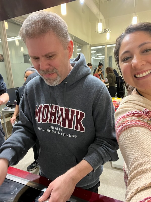 Home Bob in his healthy nutrition class at Mohawk College with a student.