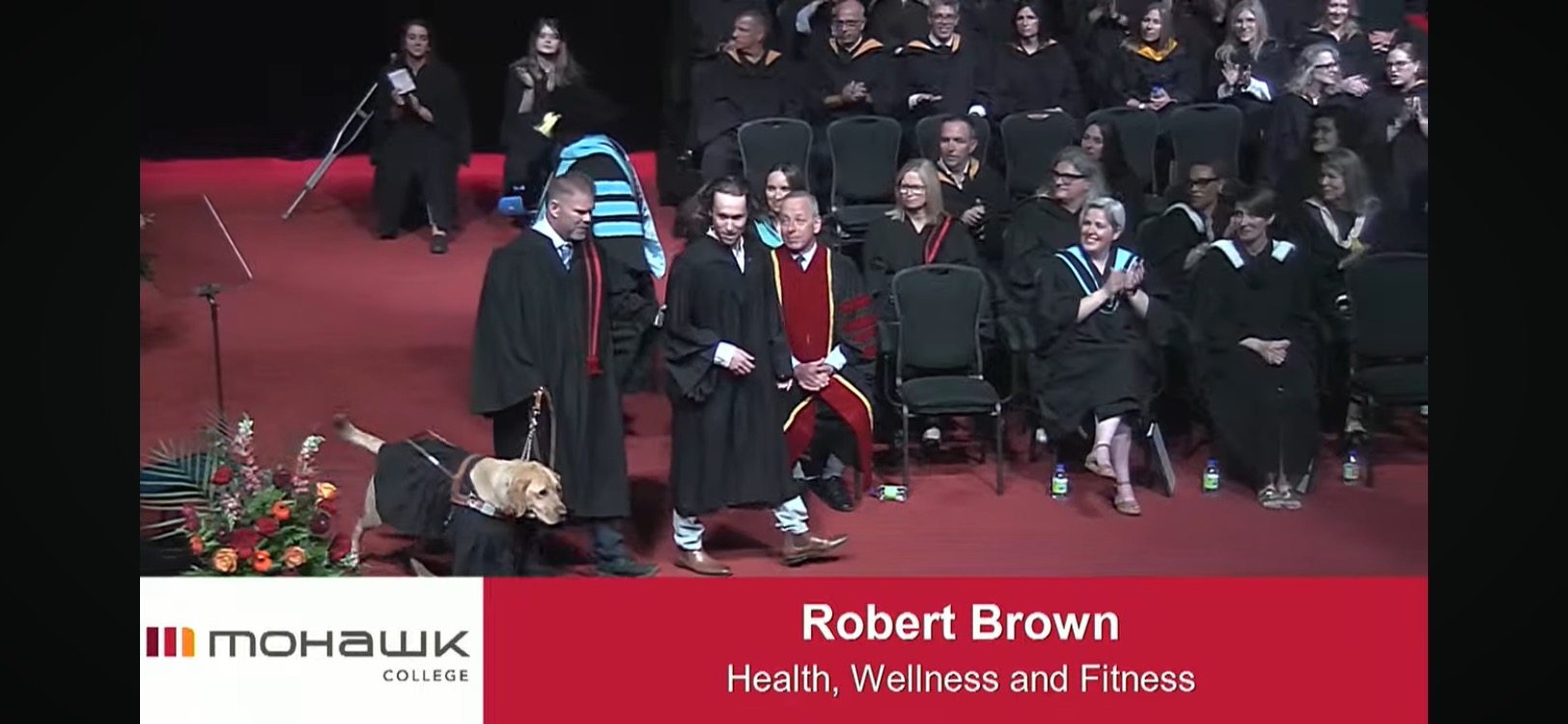 Home Bob accepting his diploma through Mohawk College